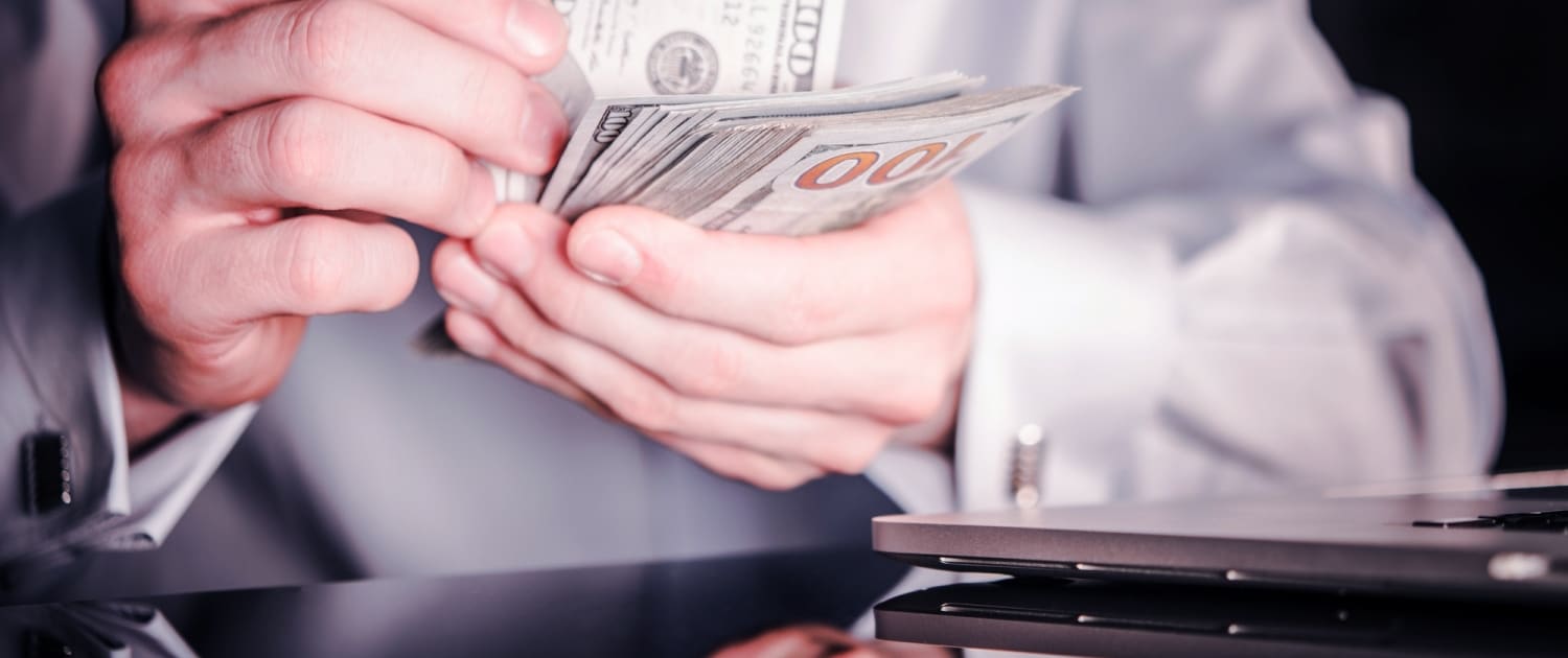 Banker Counting Cash Money